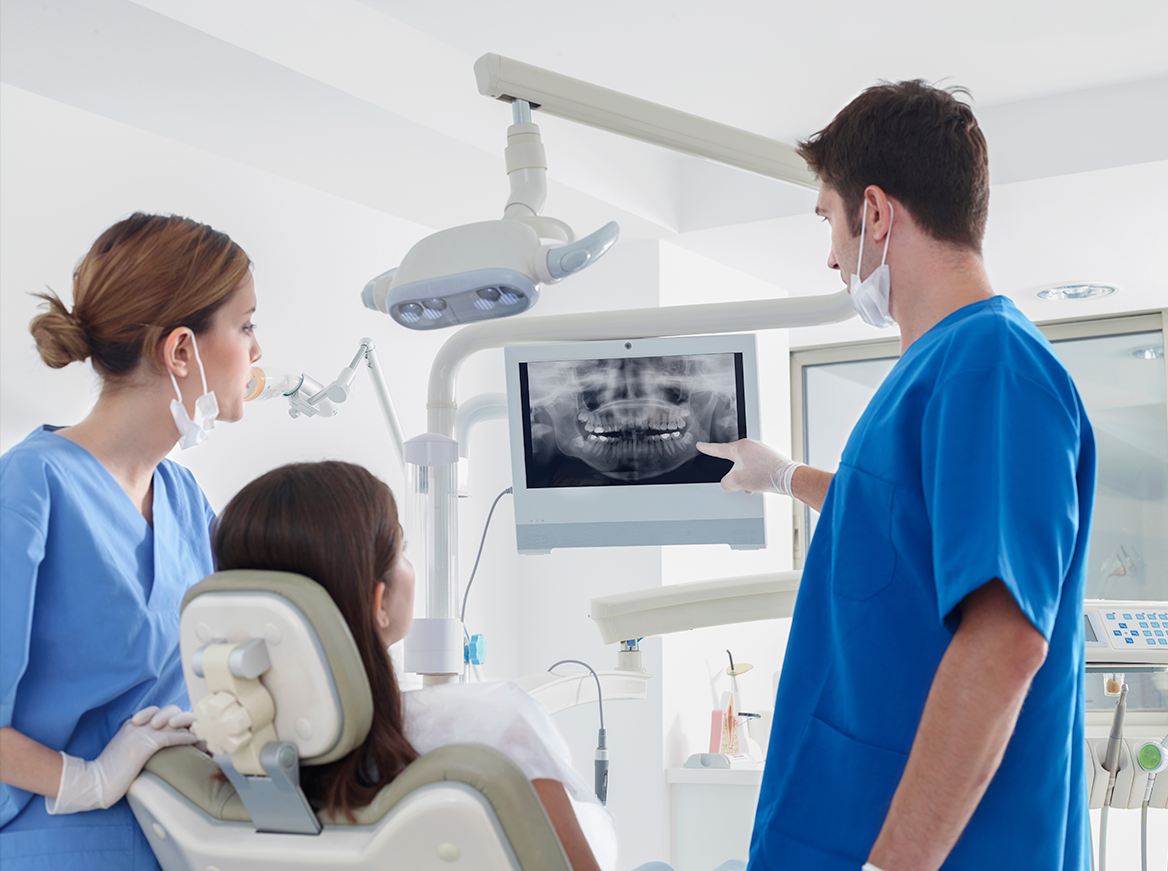 Clinicians looking at a dental xray